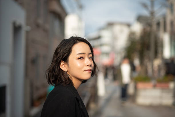 Profile of young woman's face Portrait of young woman on street japan photos stock pictures, royalty-free photos & images