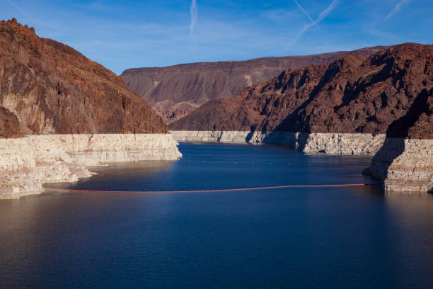 A prolonged drought in the West, the reservoir created by the Hoover Dam, pictured here in 2010, sunk to its lowest level ever raising concerns about reduced output from the dam hydroelectric plan. stock photo