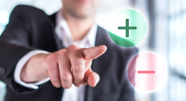Pros and cons concept. Business man touching plus or minus symbol. Pros and cons concept. Business man touching plus or minus symbol. Choosing between two options. plus computer key photos stock pictures, royalty-free photos & images