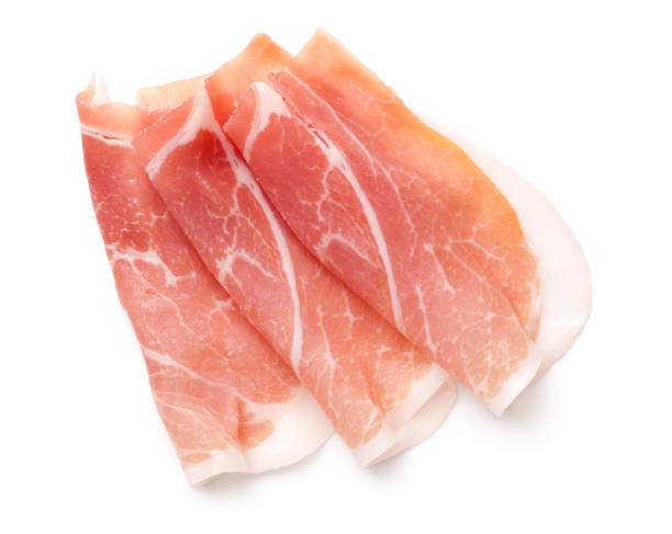 Prosciutto Slices Isolated On White Background Prosciutto slices isolated on white background. Italian appetizer. Flat lay. Top view prosciutto stock pictures, royalty-free photos & images