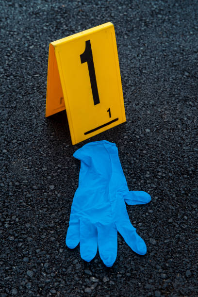 Protective glove Used protective glove on asphalt. Pollution concept. contamination photos stock pictures, royalty-free photos & images