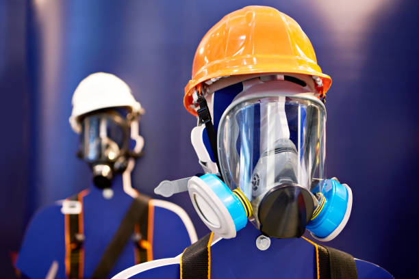 Protective masks with filters for production and construction stock photo