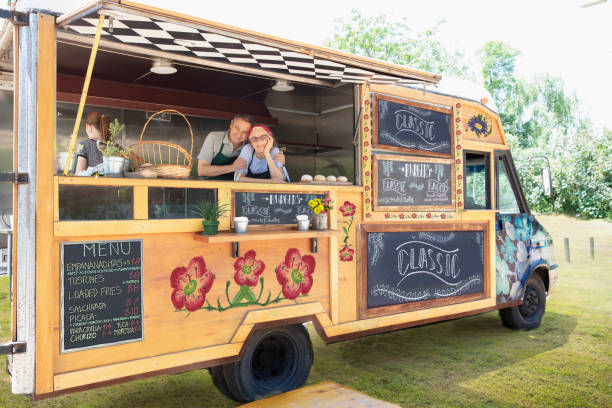 Proud couple owner of food truck stock photo