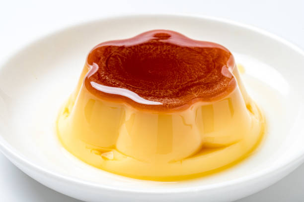 Pudding on plate on white background stock photo