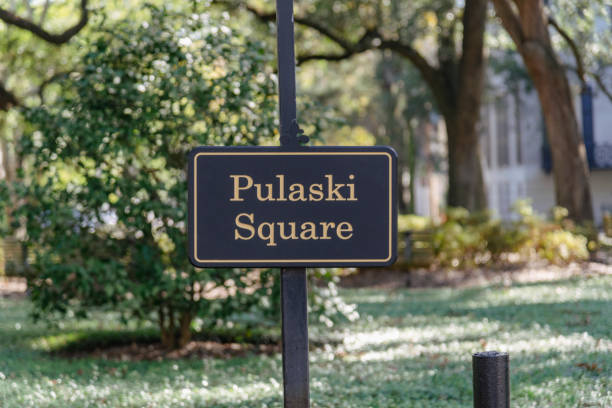 Pulaski Square Savannah Pulaski Square Park in the historic district of Savannah, Georgia. historic district stock pictures, royalty-free photos & images