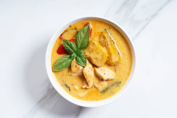 pumpkin curry pumpkin and coconut cream curry with chicken meat, asian recipe coconut milk stock pictures, royalty-free photos & images