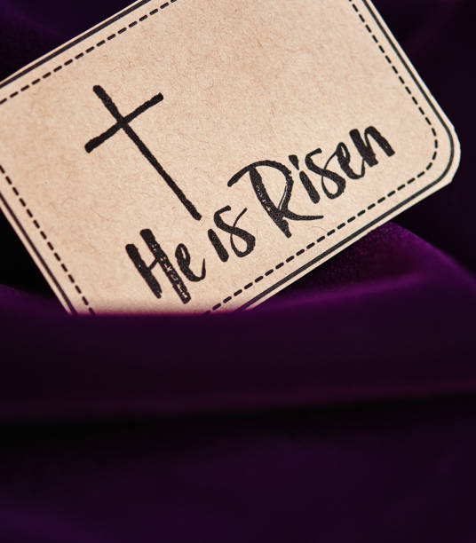 Purple background for Easter with He is Risen Script  easter sunday stock pictures, royalty-free photos & images