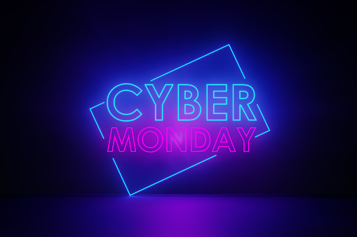 Purple neon light writes Cyber Monday on black wall. Horizontal composition with copy space. Cyber Monday concept.
