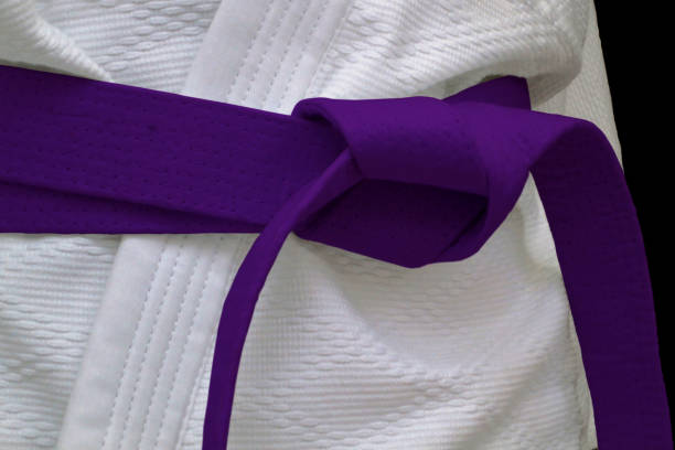 Purple obi sash Close-up on a purple belt tied around a kimono. bushido lifestyle stock pictures, royalty-free photos & images