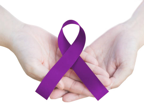purple ribbon to raise awareness for animal abuse, alzheimer's disease, domestic violence, epilepsy, lupus, sarcoidosis, crohn's disease and pancreatic cancer isolated on white background with clipping path - world cancer day imagens e fotografias de stock