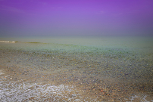 Seascape in foggy summer at Cape Cod Bay, view from Sand Neck Beach Park in Massachusetts