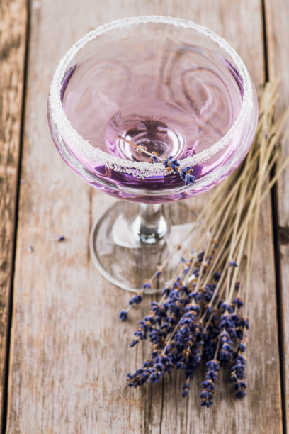 Purple soft lavender cocktail on the rustic background. Selective focus. Shallow depth of field. stock photo