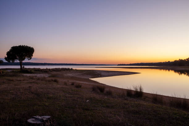 purple Sunset at the Montargil Reservoir Ponte de Sor Portugal stock photo