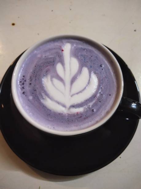 Purple taro flavored drink with cream stock photo