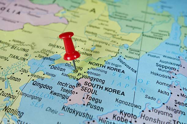 Pushpin marking on Pyongyang, North Korea map Pushpin marking on Pyongyang, North Korea map peninsula stock pictures, royalty-free photos & images