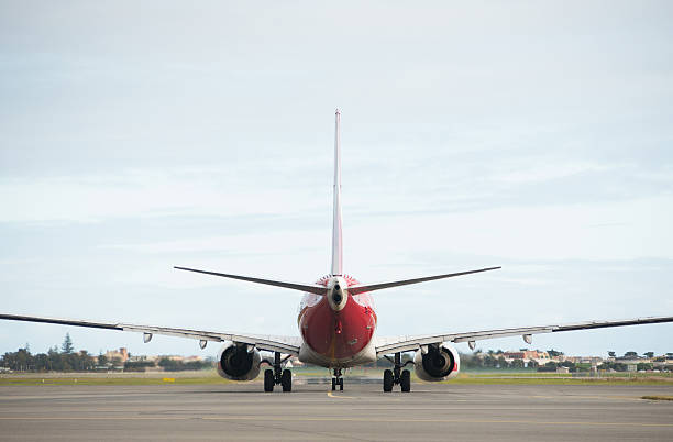 Qantas plane approaching runway at Adelaide Airport stock photo