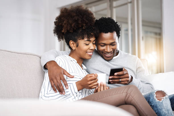 Couple Texting On Couch Stock Photos, Pictures & Royalty-Free Images ...