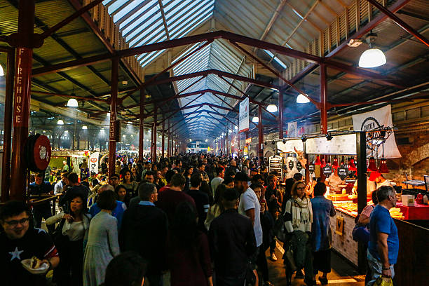 Queen Victoria Market Melbourne Australia Melbourne, Australia - November 11, 2015: Queen Victoria Market Melbourne Australia is a popular landmark known for its food stalls and farmer's markets. The location attracts thousands of visitors and locals to sample cuisine from around the world. Shot on November 11, 2015 at dusk.  queen victoria market stock pictures, royalty-free photos & images