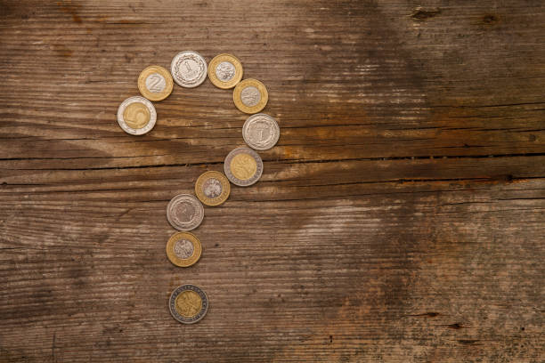 Question mark arranged from Polish coins on the table stock photo