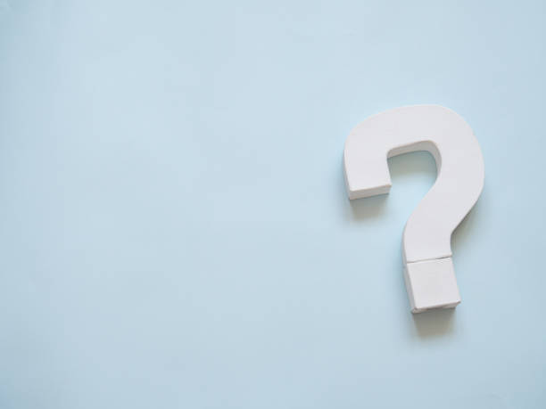 A question mark object in blue background with copy space. stock photo