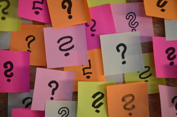 Question marks on sticky notes stock photo