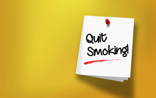 Quit Smoking Message Written On White Sticky Note Paper Quit Smoking message written on white sticky note paper attached with red push pin on yellow background. Realistic design with copy space. High resolution image to crop your design needs. stop smoking stock pictures, royalty-free photos & images