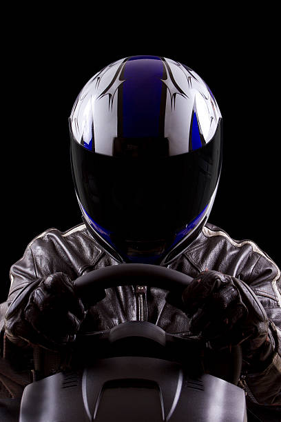 Racer Wearing a Helmet and Leather Protective Gear stock photo