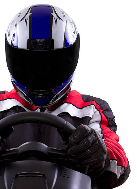 Racer Wearing a Helmet and Red Protective Gear stock photo