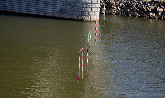 racing slalom goals for canoe and raft, kayak. Racing track with suspended striped bars