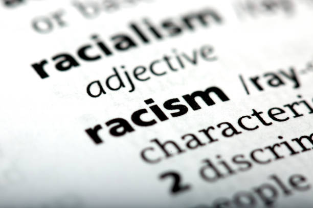 Racism is a word printed and defined in the English dictionary Racism is a word printed and defined in the English dictionary racism stock pictures, royalty-free photos & images