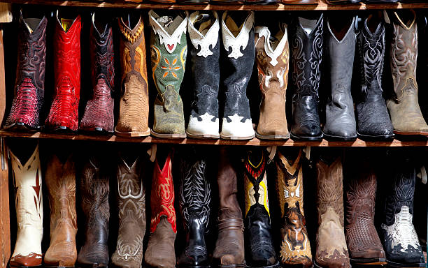 Rack of cowboy boots in shoe store, full frame  cowboy boot stock pictures, royalty-free photos & images