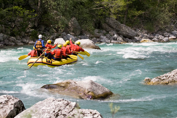 rafting Whitewater rafting on Soča river, Slovenia, Julian alps. inflatable raft stock pictures, royalty-free photos & images