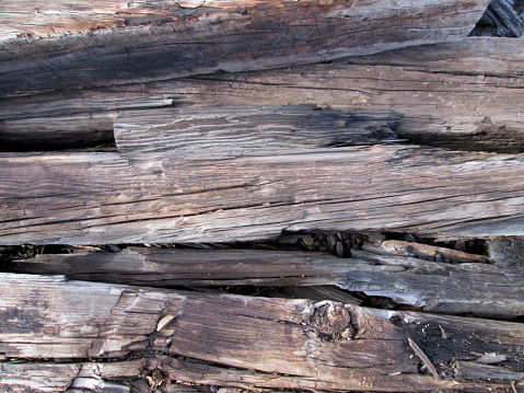 Background image of old railroad ties stacked randomly