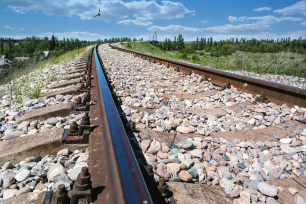 Rails leading to the horizon stock photo