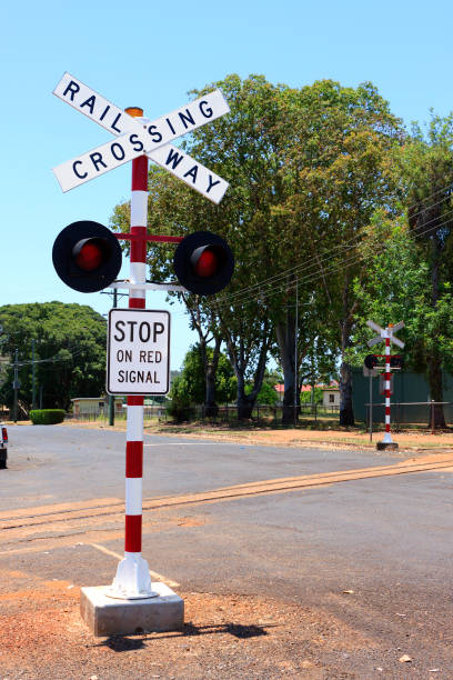 Railway Crossing Sign on a country road stock photo