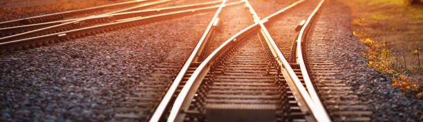 Railway track in the evening in sunset stock photo