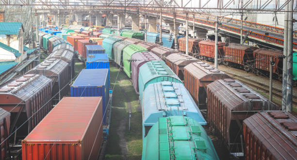Railway wagons with cargo of metal and grain in port of Odessa. trains are waiting in line for loading at cargo terminal. most economical logistics solutions for rail transport stock photo