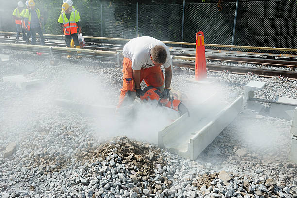 railway workers, cutting concrete - byggarbetsplats sverige bildbanksfoton och bilder