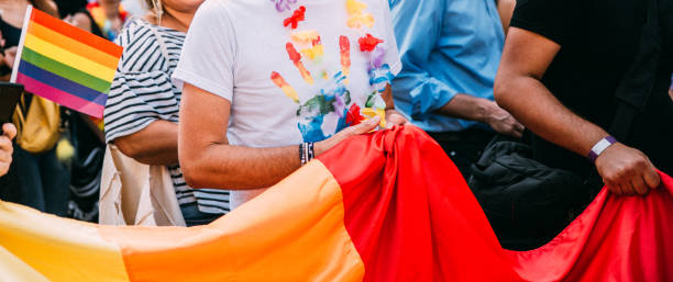 Rainbow colorful left hand printed on the white t-shirt at the Pride Parade stock photo