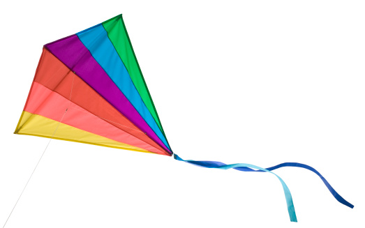 A rainbow colored delta kite isolated on white with clipping path.