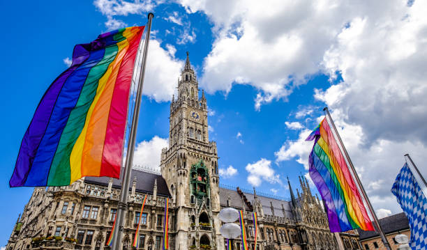 rainbow flags at the munich town hall stock photo