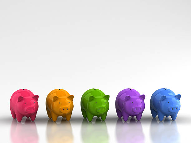 Rainbow of piggy banks representing savings growth stock photo