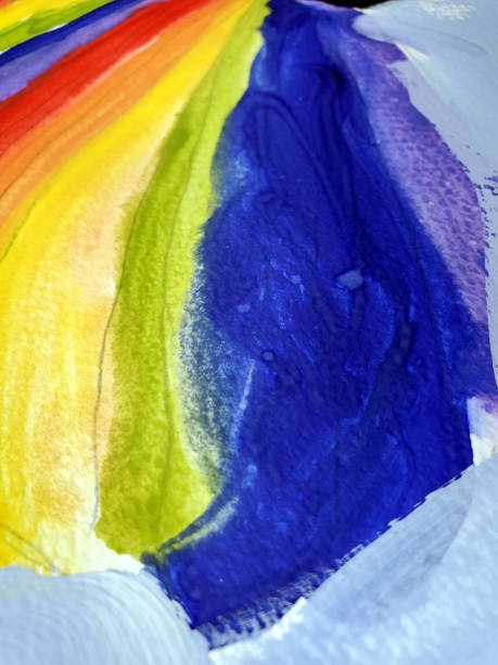 Rainbow paint texture on paper stock photo