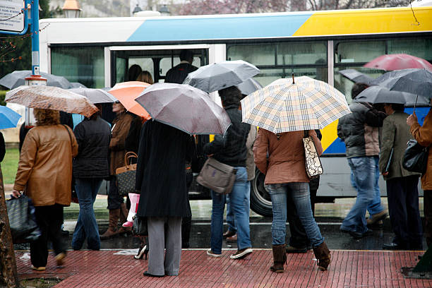 Rainy day at the bus stop stock photo