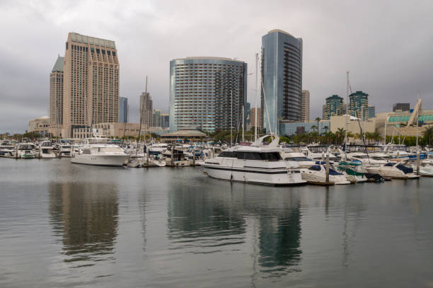 Rainy Overcast Day at the San Diego Marina and Harbor This is a view of downtown San Diego also showing the harbor and marina.  Visible in the background is the San Diego Convention Center.  This shot was taken during a cloudy, stormy day with gray skies in the bakground. has san hawkins stock pictures, royalty-free photos & images