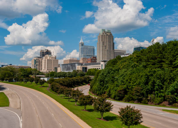Raleigh NC Skyline Raleigh NC Skyline on a sunny day from the MLK bridge durham stock pictures, royalty-free photos & images