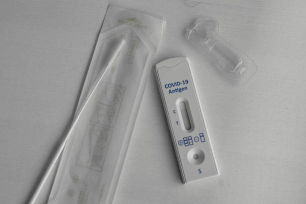 Rapid Covid tester on a table Covid-19 test kit for detecting IgM IgG antibodies and immunity in 15 minutes. severe acute respiratory syndrome photos stock pictures, royalty-free photos & images