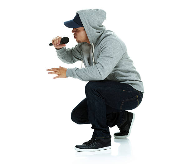 Rapper singing song with microphone Rapper singing song with microphonehttp://www.twodozendesign.info/i/1.png rapper stock pictures, royalty-free photos & images