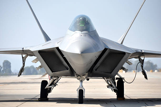 F22 Raptor "An F-22 Raptor stealth fighter parked on the ramp at Miramar MCAS, San Diego, California." us air force stock pictures, royalty-free photos & images