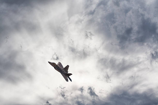 F22 Raptor Soaring Above the Clouds stock photo